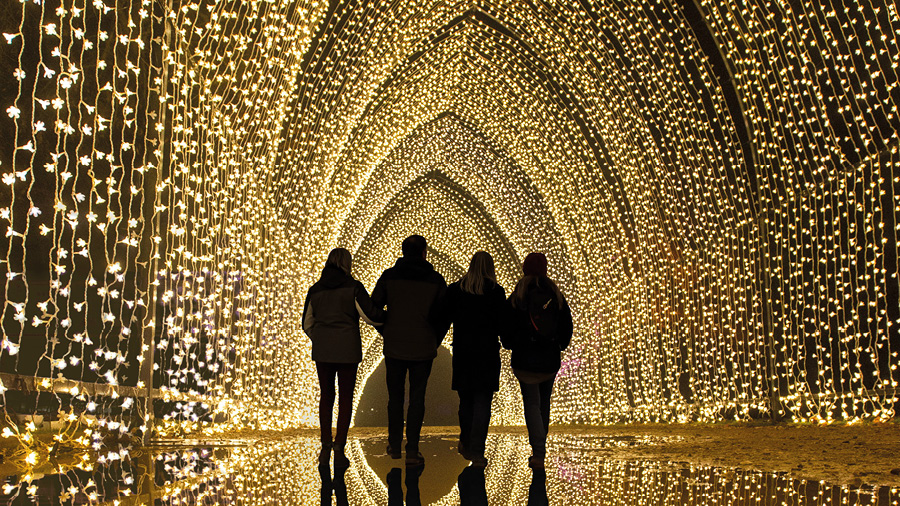 Silhouette of family in light archway